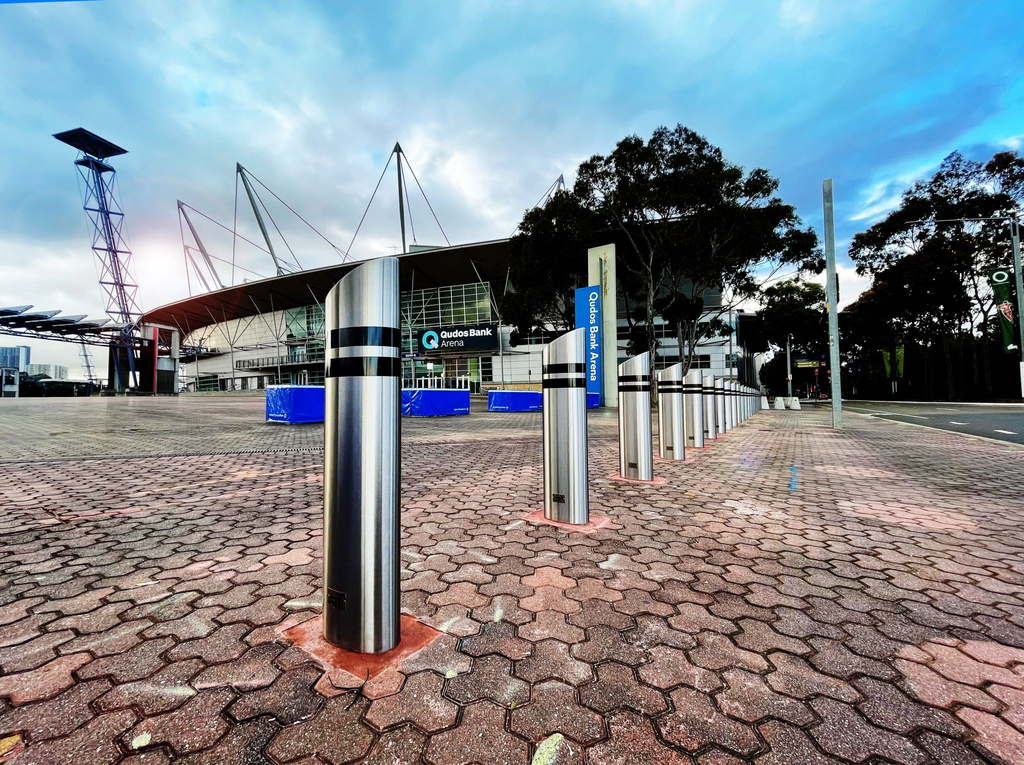 Manufacturer illustration from the Truckstopper 6-30 datasheet: bollards along a brick-paved entrance