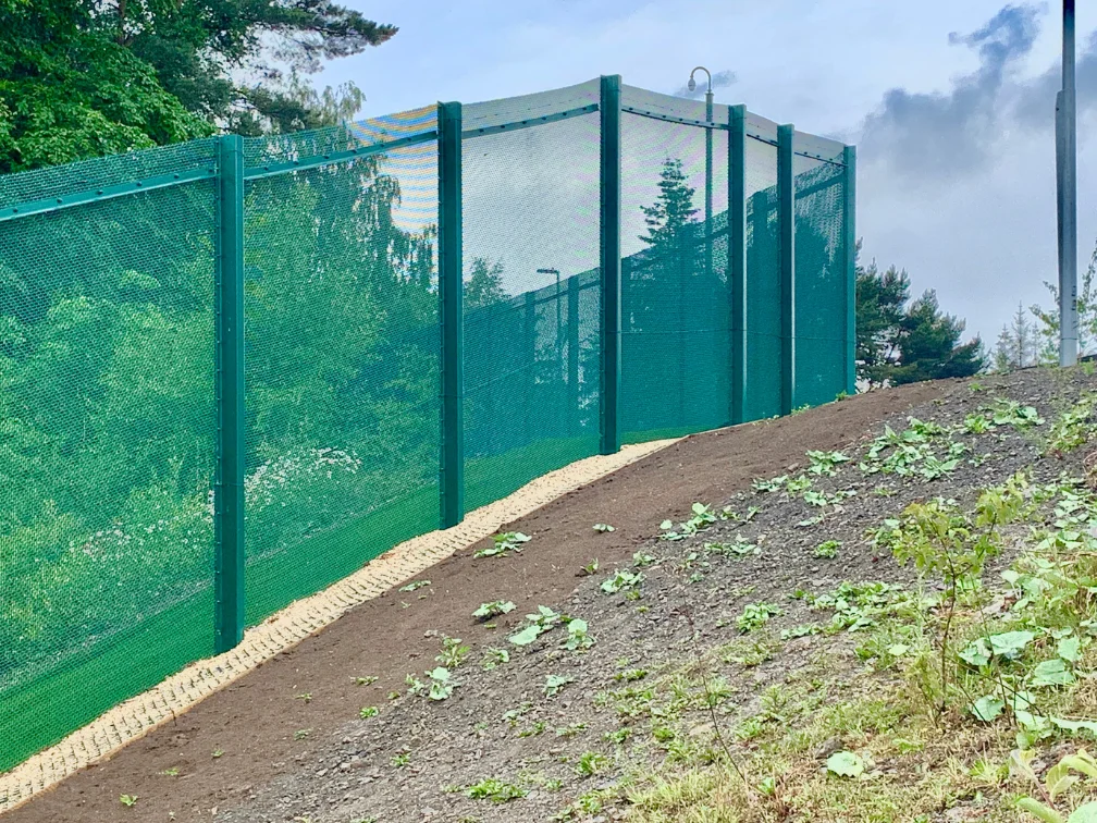 CANFEN ARMAWEAVE woven mesh security fence installed on a steep graded embankment at a Thames Water facility in the UK