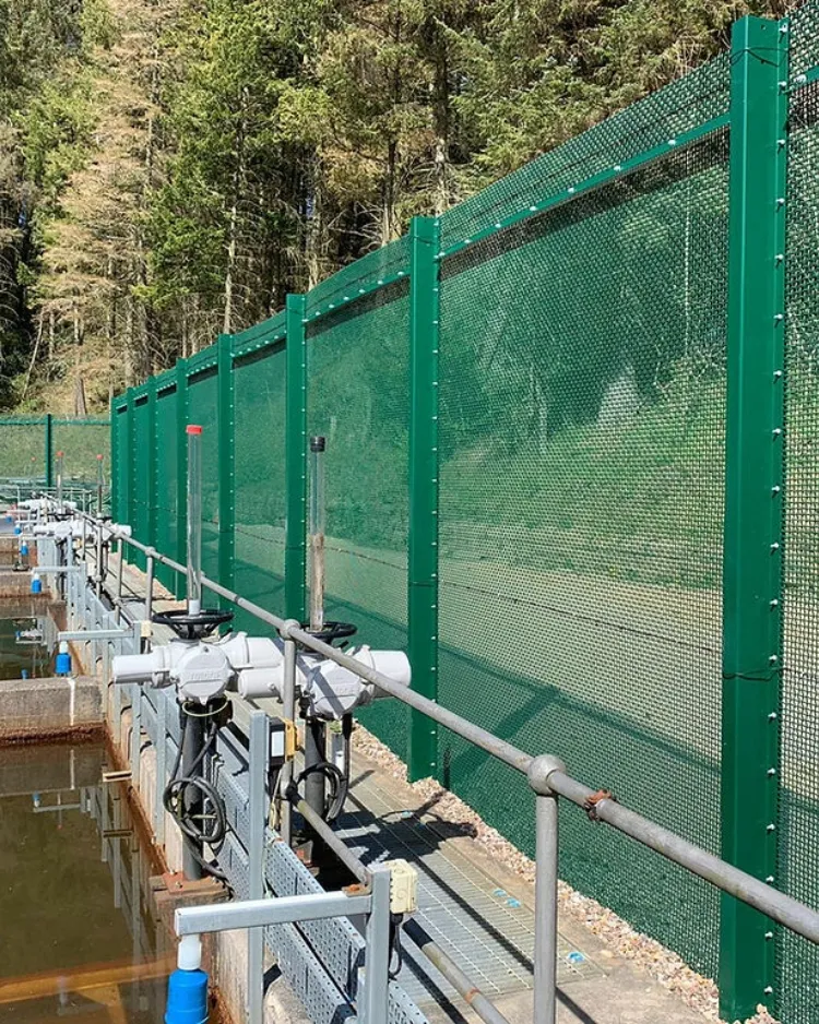 FST flexible security topping installed on a green mesh perimeter fence at a Severn Trent Water reservoir site in the UK